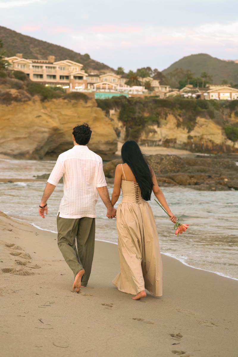 Walking hand in hand along the beach